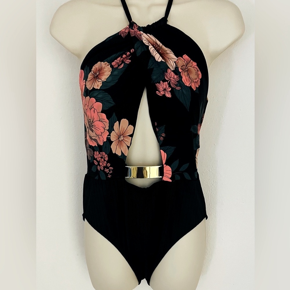Size medium women’s Time and Tru bathing suit, floral, print with cut out middle
